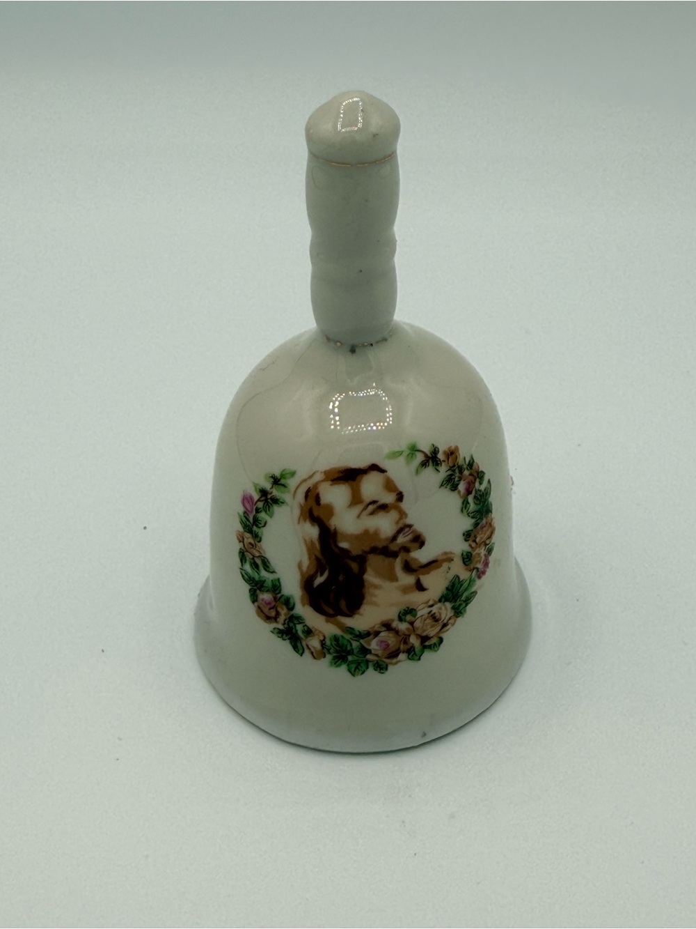 Working Porcelain Hand Bell depicting Floral Wreath with Jesus Portrait - White